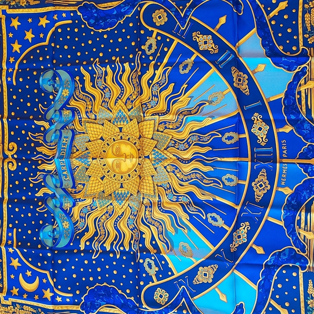 Blue Hermes silk scarf.